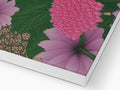 A floral printed card sits on top of and under a white paper box.