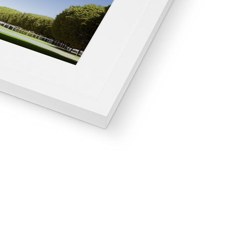 A white picture is on a hardcover in a photo frame.