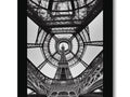 A framed black and white picture of an image of the Eiffel tower on a