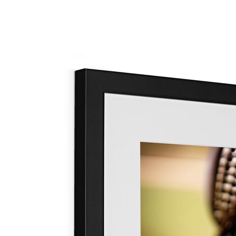 A glass picture frame is framed with a close-up camera on it.