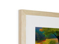 A picture frame with an image of two wooden trees, one is on top of the