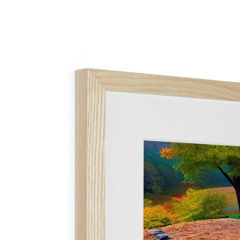 A picture frame with an image of two wooden trees, one is on top of the