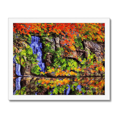 A large painting of colorful fall foliage with moss on it on a rock protruding from