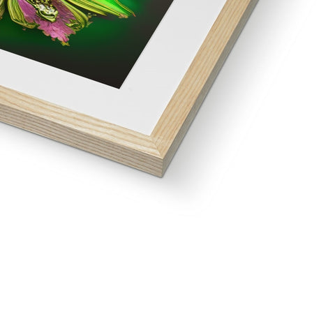 A wooden photograph is on top of a frame with a picture of an owl in the