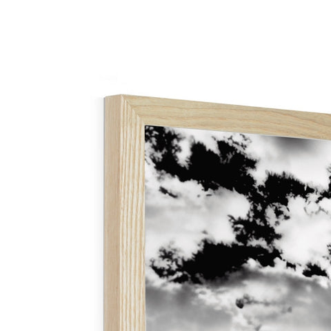 A black and white panorama of cloud and clouds on a wood frame.