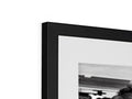 An image of a picture frame with an attractive black and white picture sitting next to it