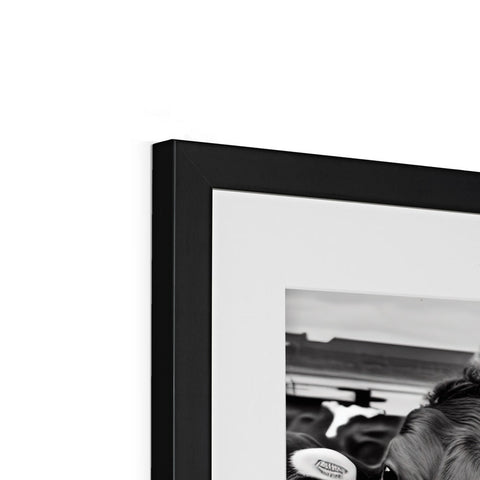 An image of a picture frame with an attractive black and white picture sitting next to it