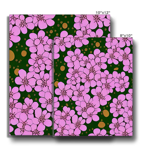 A bathroom bed has a floral pattern in a kitchen towel covered with pink flowers.