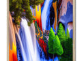A river flowing down through a manmade waterfall with colorful prints on a picture frame.