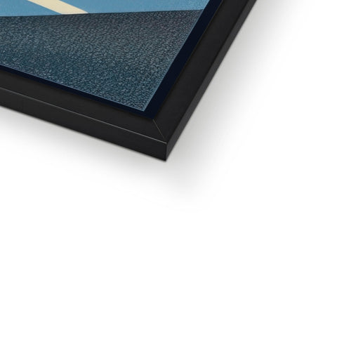 A picture frame with a photograph of an image that shows a road.