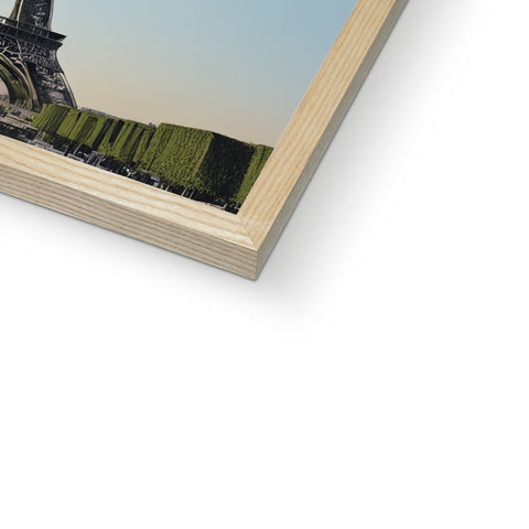 A picture frame with an eiffel tower printed on it on a white background