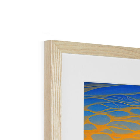 A photo framed in blue and gold artwork is on a wooden frame.