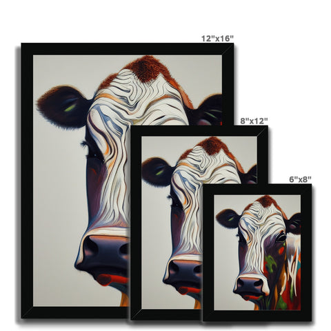 Art prints of cows on art glass in a barn with white curtains.