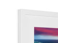 A photo frame containing a red and white photo of an imac on it's frame