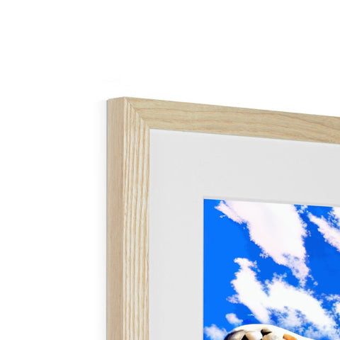 A picture frame with a photograph in it on top of a white background.