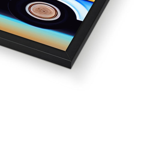 A picture frame with an image of an art print next to a computer monitor.