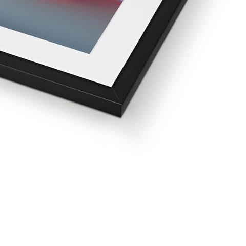 A picture frame of an abstract photograph sitting inside of a frame.