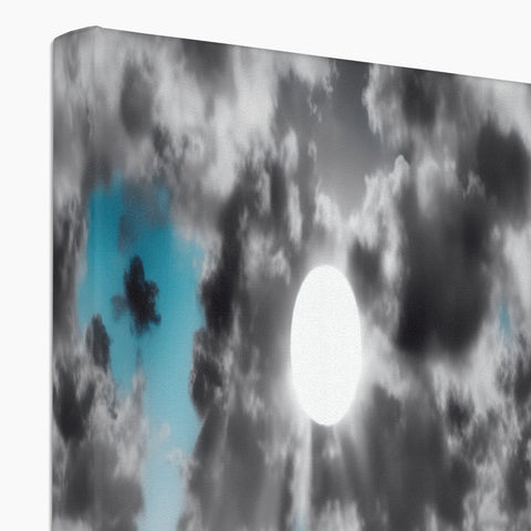 A large flat screen TV with sunlight and clouds that hang in the background.