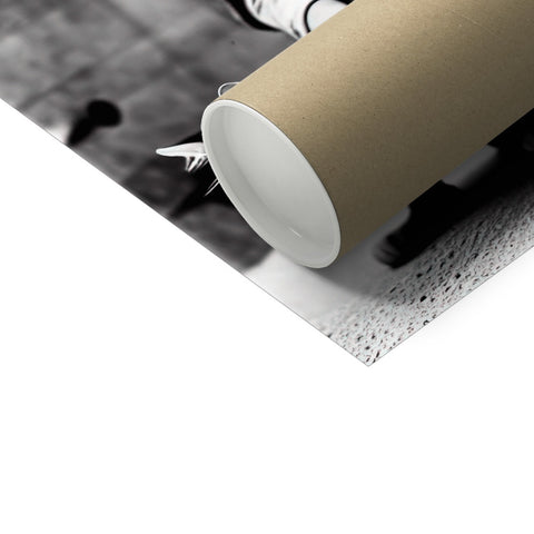 A roll of black and white paper sitting on a floor.