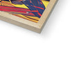 A softcover book sitting on top of a wooden page with colorful art on it.