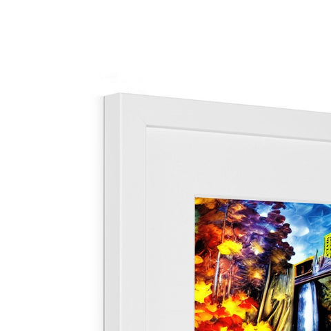 A framed photo is seen in a picture frame next to some colorful art on top of