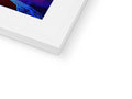 A picture frame with an imac print in it on the end of the wall,
