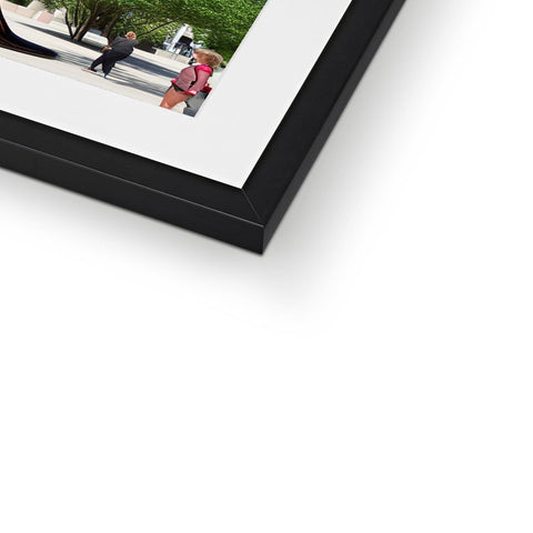 An image of a picture frame with a photo sitting on top of it.