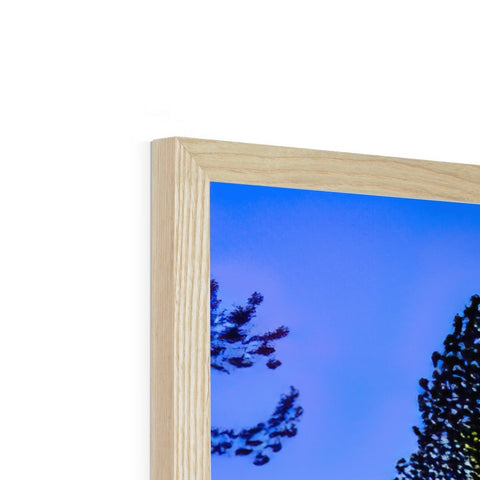 A wooden photo frame with a picture of a tree on it’s top side