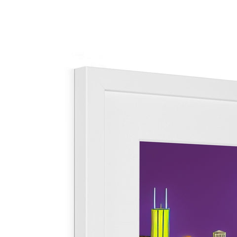 A toothbrush sitting in front of a city skyline on a picture frame.