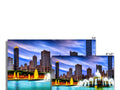 A colorful printed board with an image of Chicago at night on it.