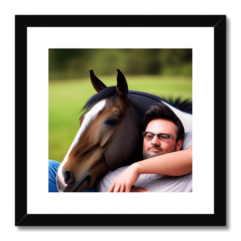 A framed picture of a man sitting on a horse holding a woman on his chest.