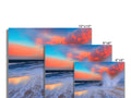 A display panel of four pictures on a flat view screen next to a coffee table.