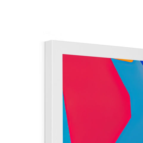A blue and pink art print on white paper sits in front of a computer.