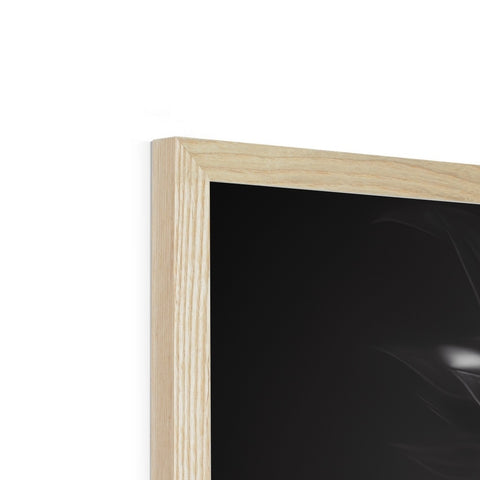 A picture frame with wood panels and a light on a table.