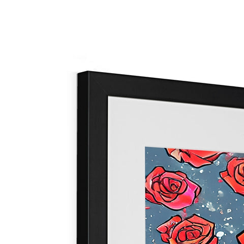A close up of an art print sitting on a photo frame with flowers.