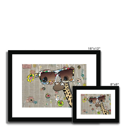 a framed giraffe print sitting on a table with aviators and bird pictures on