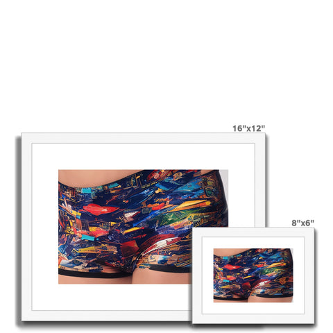 Two people stand on a small beach wearing swimming trunks with shirts underneath "art print