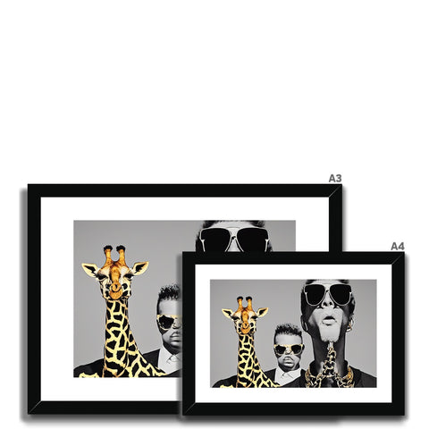 A picture frame containing four giraffe standing near other photos.