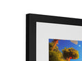 A picture frame sits on top of a wall with a printed print on it.