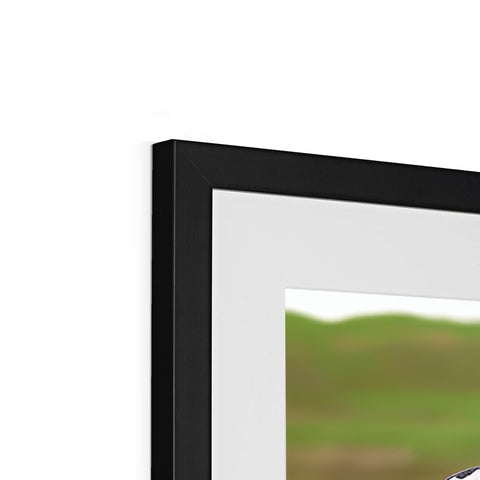 An empty frame is on top of a picture frame holding a television screen.