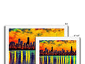 A photo shoot of a colorful picture of cityscape next to a colorful postcard on
