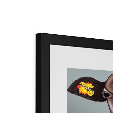 A photo of a golliwog on a picture frame in a wall