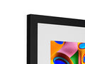 A photo of a large framed picture on the frame with colorful art on it.