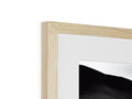 Many pieces of wood are displayed in a photo frame on a white wall.