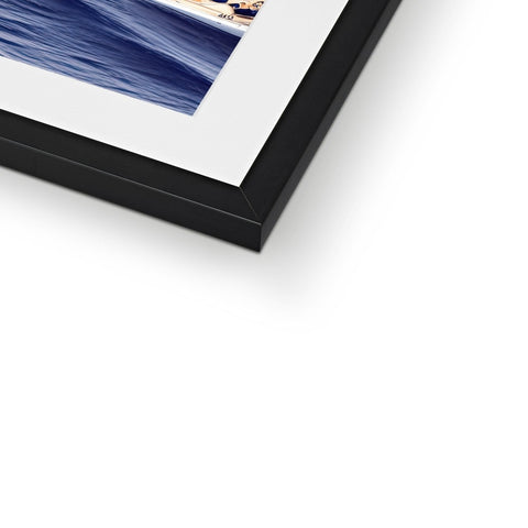 A photo of a picture displayed on a frame with glass covered with blue and white.