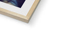 there is a picture of a picture in a wooden frame in a white picture book with