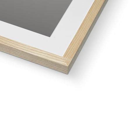 A picture frame with wood framed with a white object on top of it.
