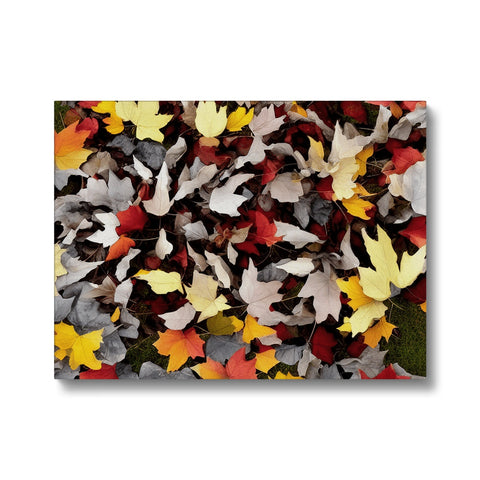 A table of placemats on a leaf covered wooden wall with autumn foliage.