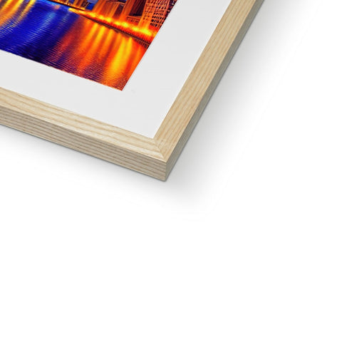 A photograph of a wood framed art print in a coffee table.