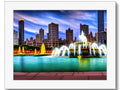 An art print with Chicago's skyline and some other cityscapes on the background.